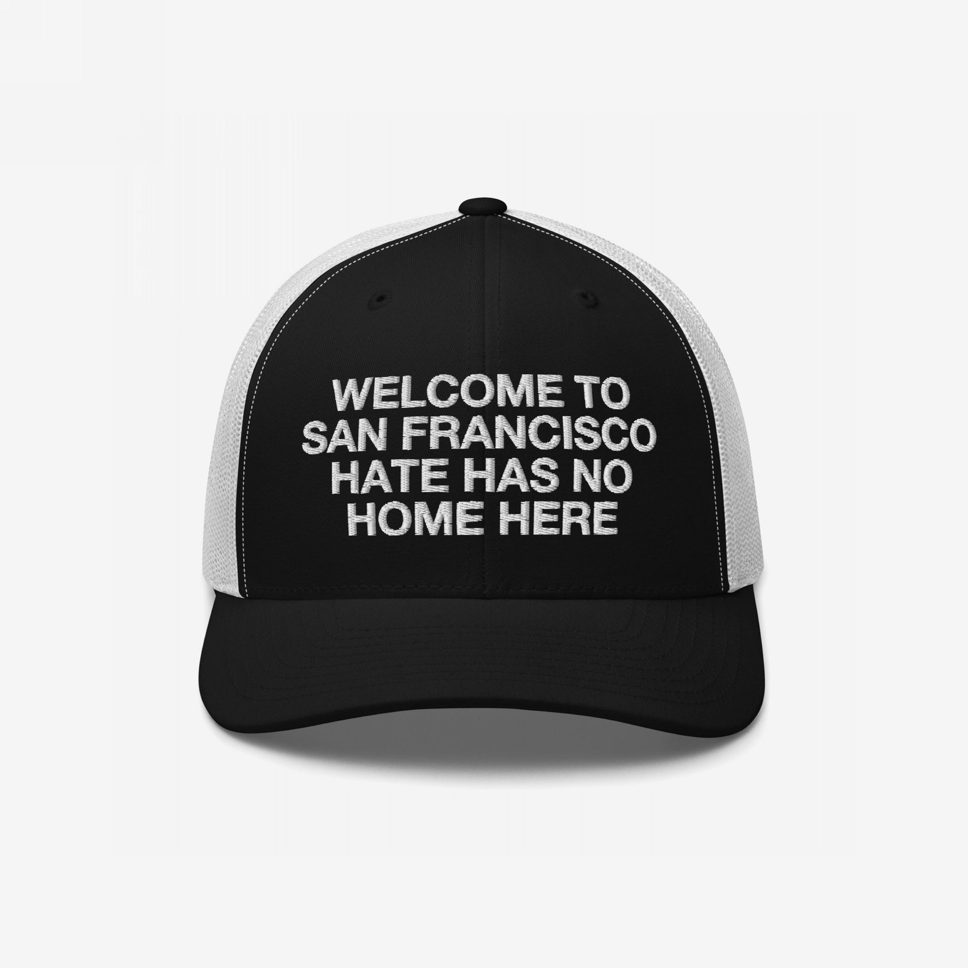 Custom Hate Has No Home Here Trucker Hat featuring customizable welcome message with breathable mesh and adjustable snap closure for comfort.