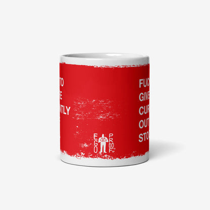 White ceramic Fucks To Give Mug with a red panel, bold white text stating fucks to give currently out of stock, and EGO PROOF logo, conveying a bold statement on emotional availability.