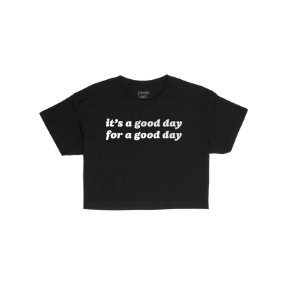 Good Day Women's Baby Tee features it’s a good day for a good day. slogan in white on a fitted black T-shirt, offering dail