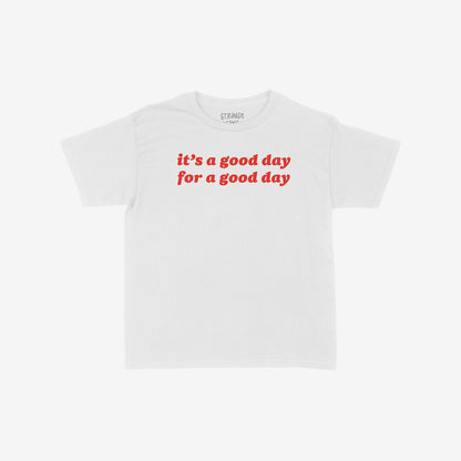 Good Day Kids T-shirt EU features bold red lettering, It’s a good day for a good day, on a white tee. Designed for kids, it embodies optimism and playful confidence.