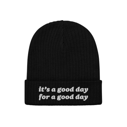 Black rib-knit beanie titled Good Day Hat with the phrase “it’s a good day for a good day” embroidered in white on the 