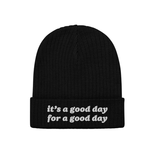 Black rib-knit beanie titled Good Day Hat with the phrase “it’s a good day for a good day” embroidered in white on the 