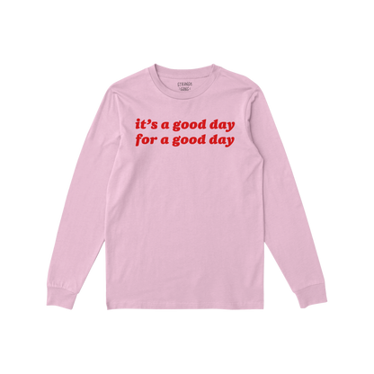 Good Day T-shirt in soft pink with red positive message text, long sleeves, comfortable fit for everyday optimism and self-ca