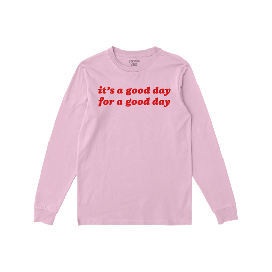 Good Day T-shirt in soft pink with red positive message text, long sleeves, comfortable fit for everyday optimism and self-ca