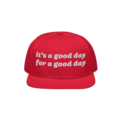 The Good Day Hat features a flat-brimmed, snapback design with white embroidery stating it’s a good day for a good day, pro