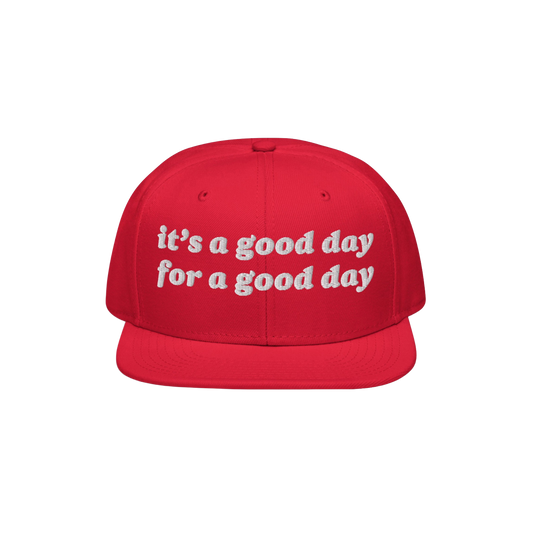 The Good Day Hat features a flat-brimmed, snapback design with white embroidery stating it’s a good day for a good day, pro