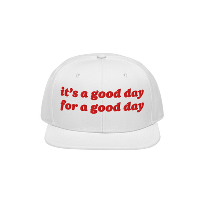 The Good Day Hat features a bold red embroidered message, it’s a good day for a good day, on the front of a white snapback,