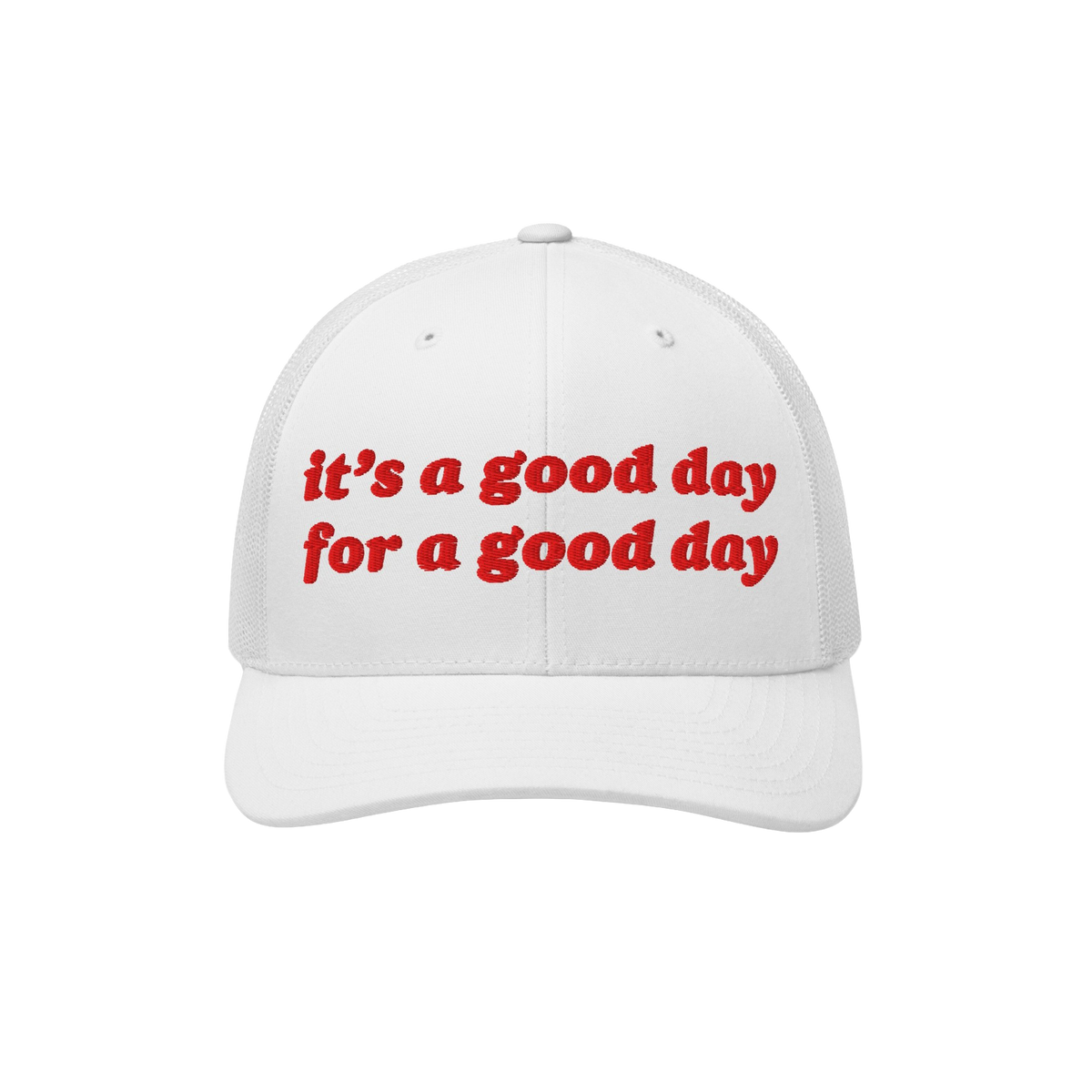 The Good Day Hat features a white trucker-style cap with a mesh back and curved brim, showcasing bright red embroidery readin