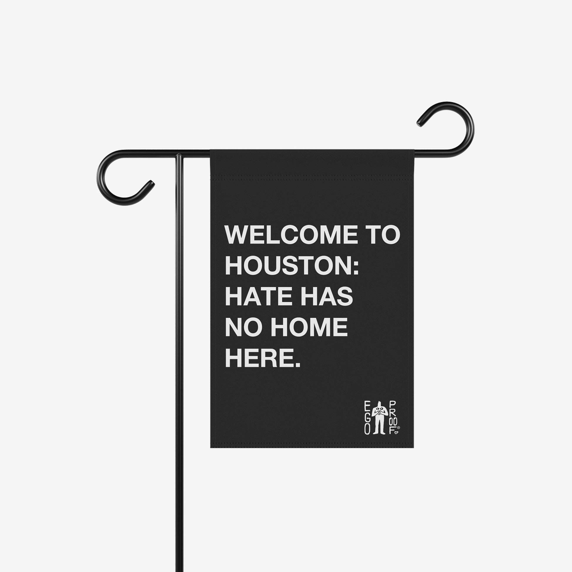 Custom Hate Has No Home Here Garden Flag on a black metal stand, featuring bold white text promoting inclusivity in Houston, alongside the EGO PROOF logo, aligning with Egoproof's empowering message.