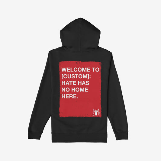 Custom Hate Has No Home Here Hoodie features a bold red rectangle on the back with a powerful anti-hate message, accented by Ego Proof’s logo, promoting unity through personalized location customization.
