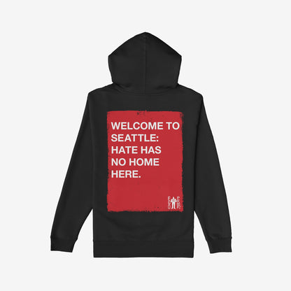 Custom Hate Has No Home Here Hoodie featuring bold white text on a distressed red rectangle on the back, conveying a strong message against hate, aligned with Egoproof's ethos of powerful, meaningful statements.