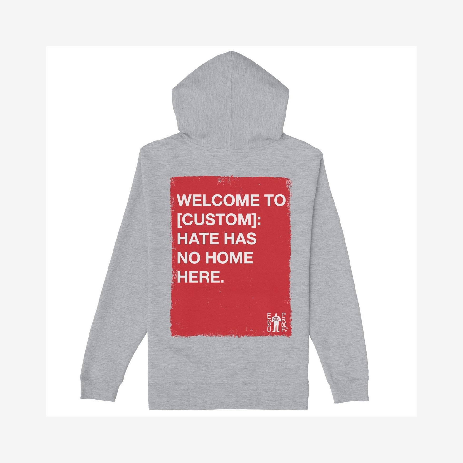 Custom Hate Has No Home Here Hoodie: Back view shows a distressed red graphic with customizable space for location, reinforcing unity with Hate Has No Home Here message. Small EGO PROD. logo included.