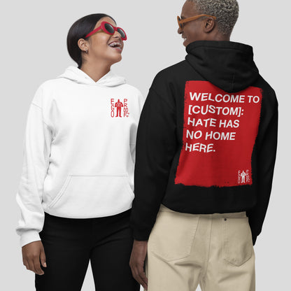 Two models wear the Custom Hate Has No Home Here Hoodie. The left features a red EGO PROD. logo, while the right showcases a bold red square with an inclusive message on the back.