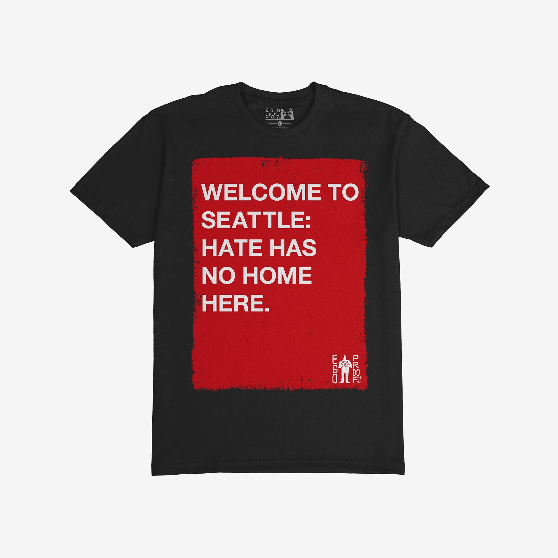 Custom Hate Has No Home Here T-shirt featuring a red square with the message “Welcome to Seattle: Hate Has No Home Here” in white block letters, with a small EGO PROOF logo.