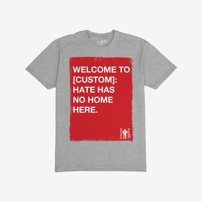 Custom Hate Has No Home Here T-shirt features a painted red square with bold white text. Personalize your location to promote inclusion and resist hate, embodying Egoproof's message of powerful everyday statements.