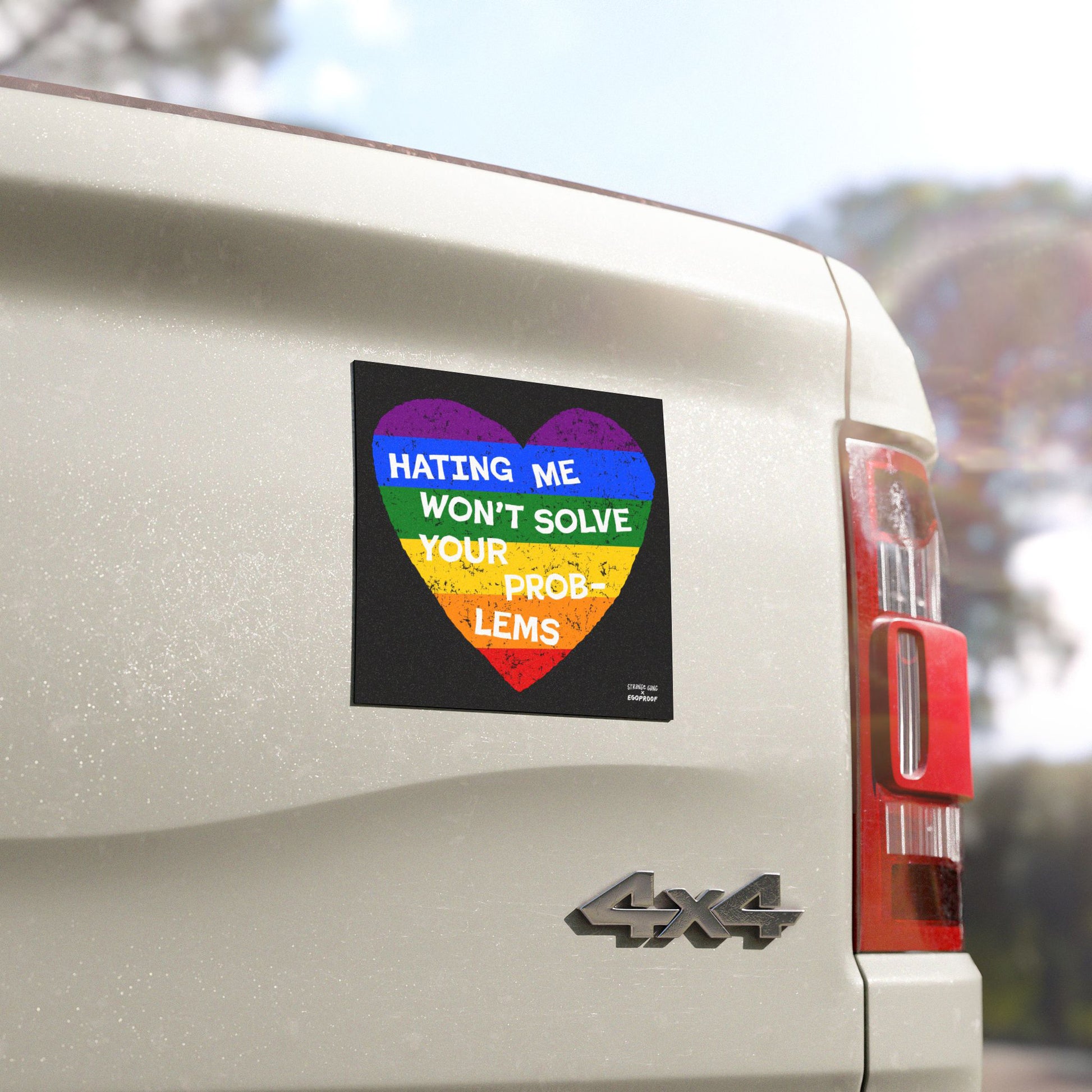 No LGBTQ Hate Sticker & Magnet showing a rainbow heart with "Hating Me Won't Solve Your Problems" on a white vehicle’s rear side.