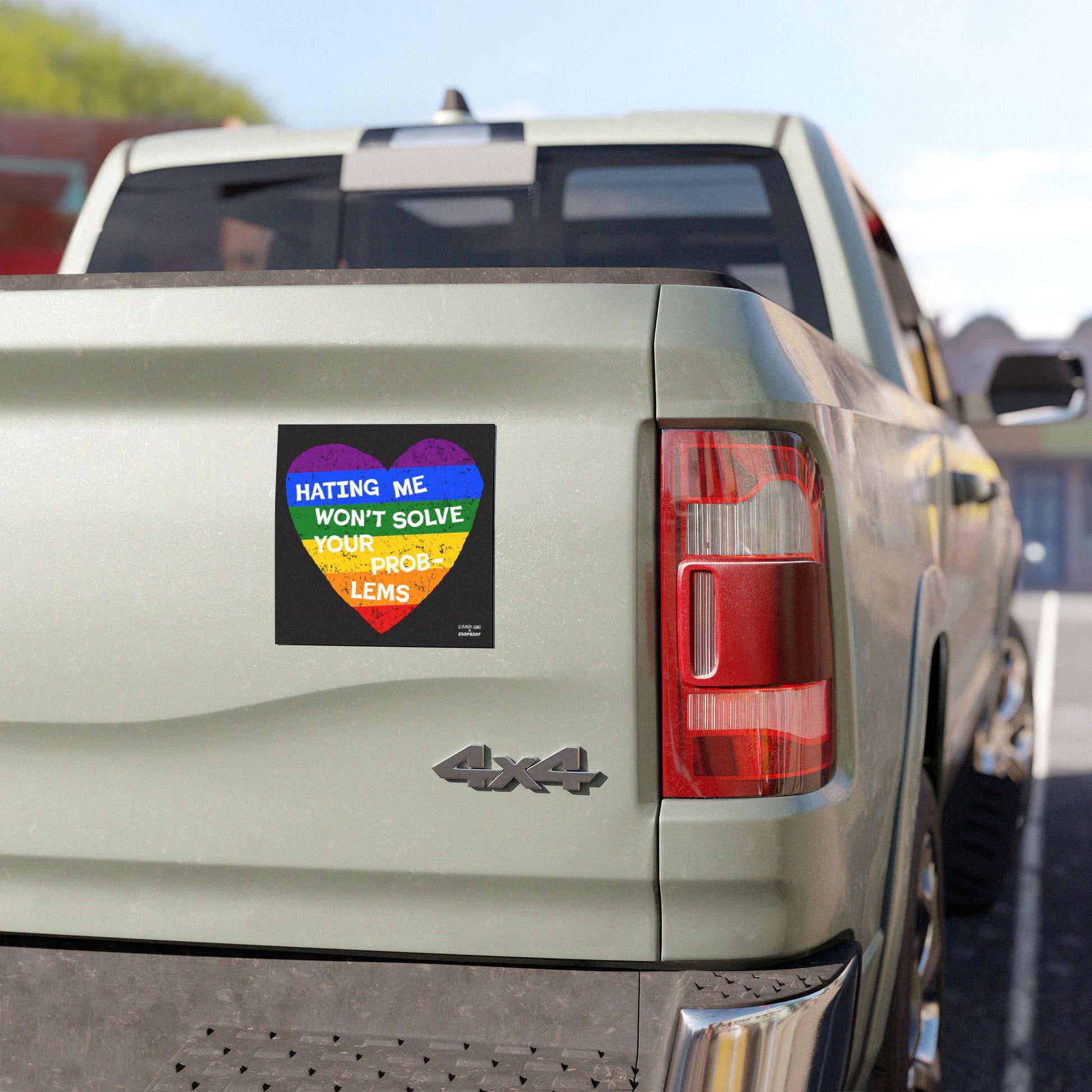 No LGBTQ Hate Sticker & Magnet with rainbow heart and text “Hating Me Won’t Solve Your Problems” on the back of a pickup truck.