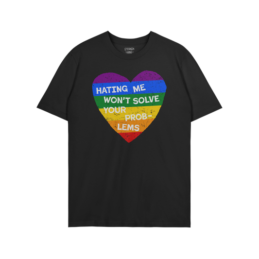 No LGBTQ Hate T-shirt with rainbow heart graphic and text Hating Me Won't Solve Your Problems on black background.