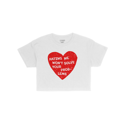 No Hate Women's Baby Tee with a red heart graphic and the message "Hating Me Won't Solve Your Problems" on a white cropped ba