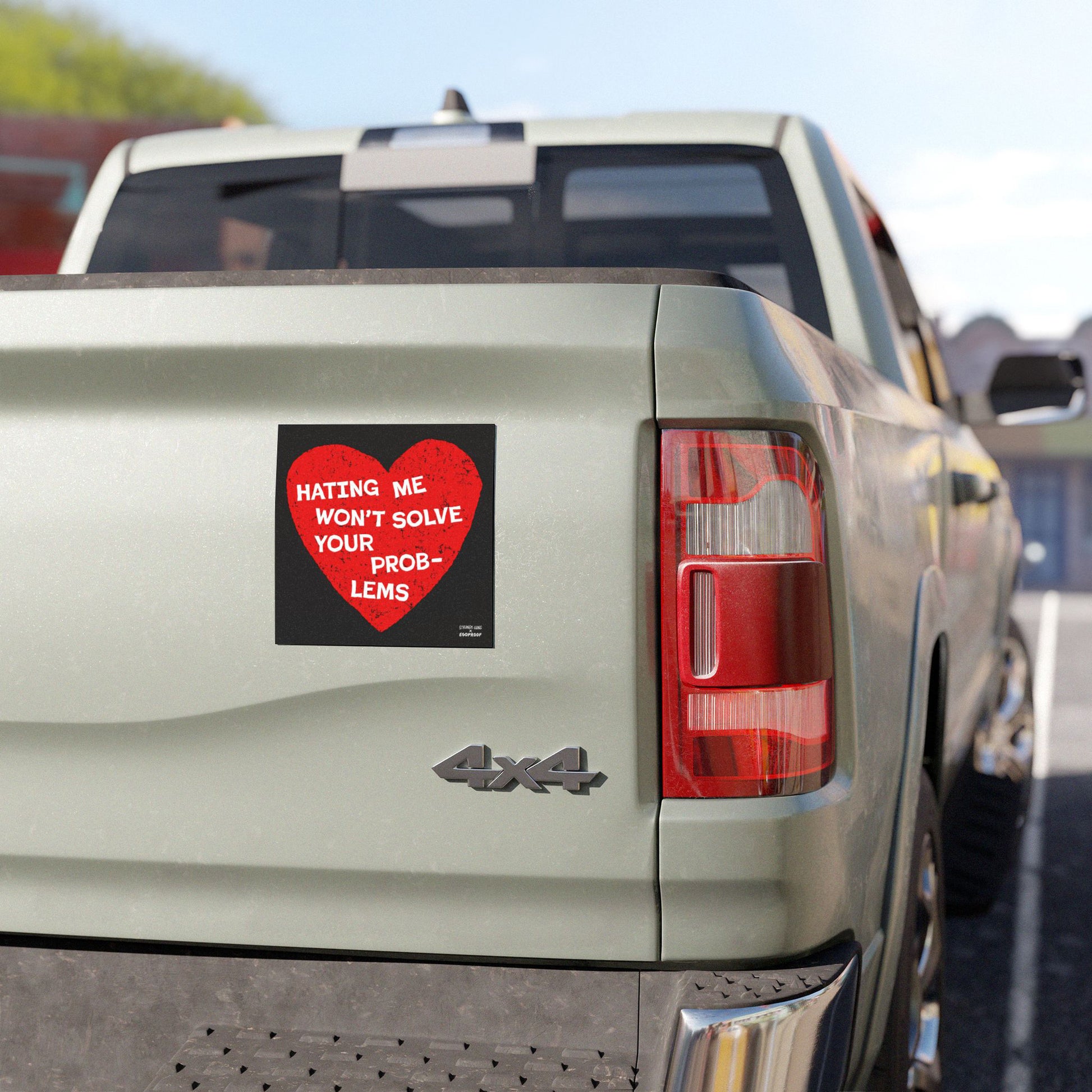 No Hate Sticker & Magnet featuring a red heart with "Hating Me Won’t Solve Your Problems" on a truck tailgate.