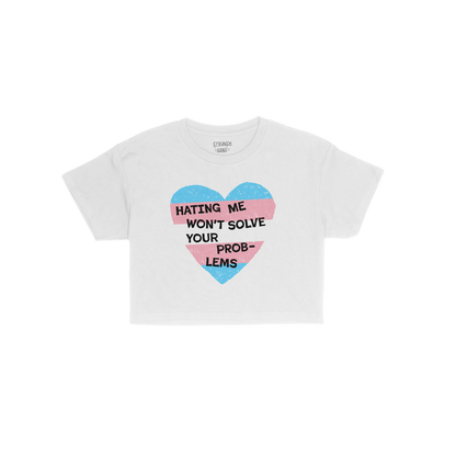 No Trans Hate Women's Baby Tee white with trans pride heart and text "Hating Me Won’t Solve Your Problems" statement design