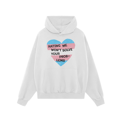 White No Trans Hate Hoodie with a heart design in trans flag colors and the message "Hating Me Won’t Solve Your Problems" o