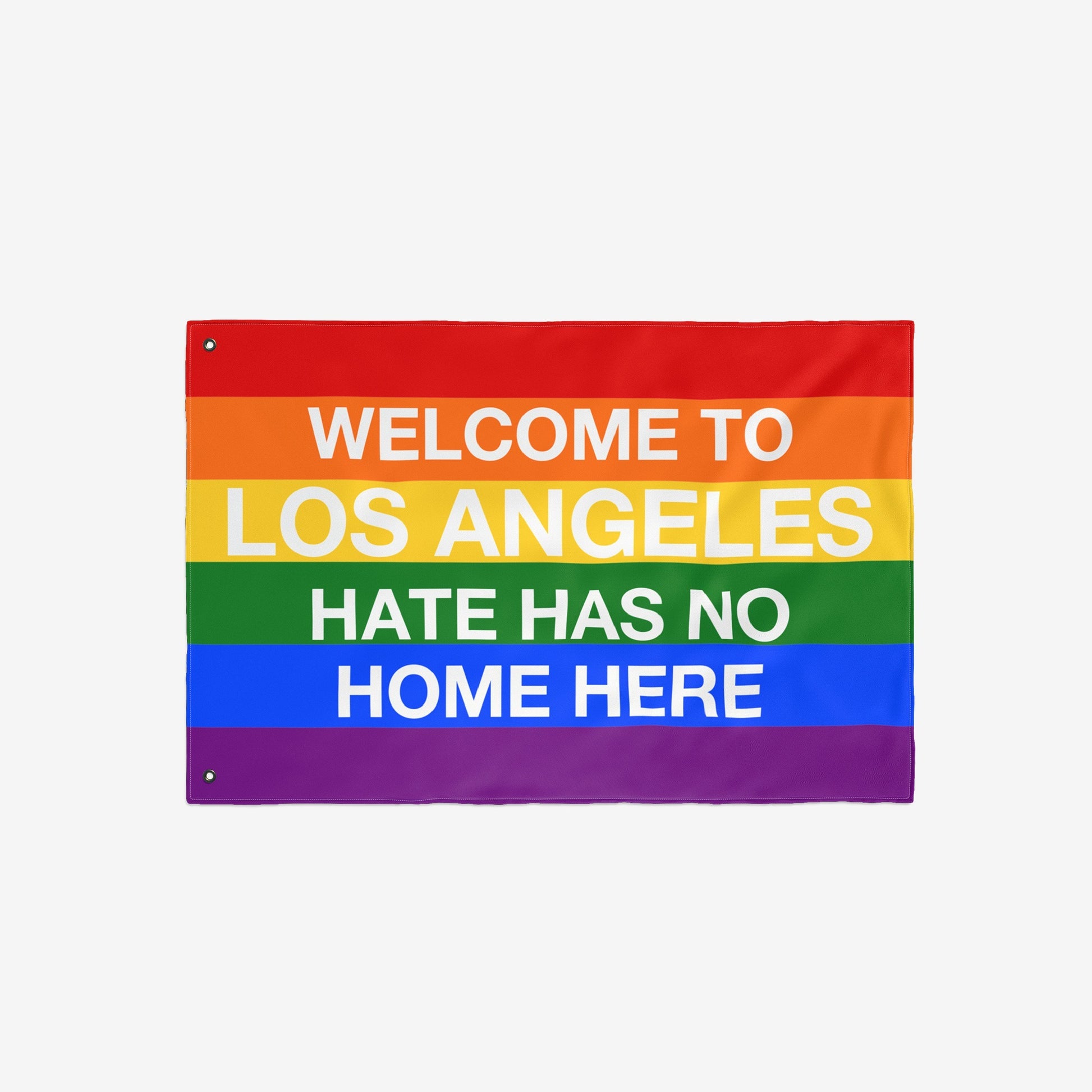 Custom Hate Has No Home Here Pride Flag featuring rainbow stripes and bold white text, expressing inclusivity with WELCOME TO LOS ANGELES HATE HAS NO HOME HERE. Ideal for celebrating LGBTQ+ acceptance.