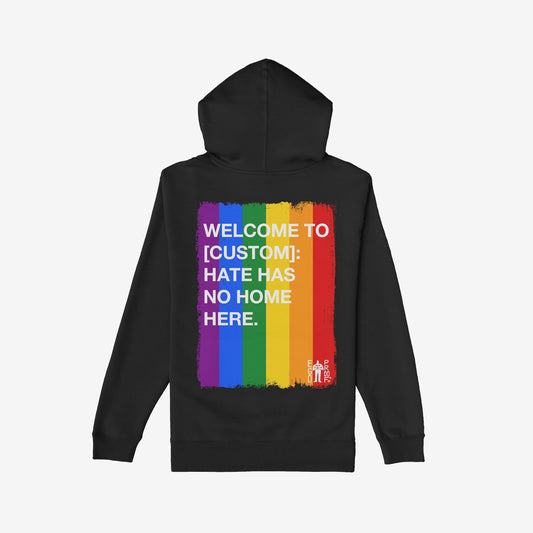 Custom Hate Has No Home Here Pride Hoodie featuring a rainbow stripe with bold white text on the back, promoting inclusivity. Includes small EGO PROOF. logo, emphasizing support for LGBTQ+ acceptance.