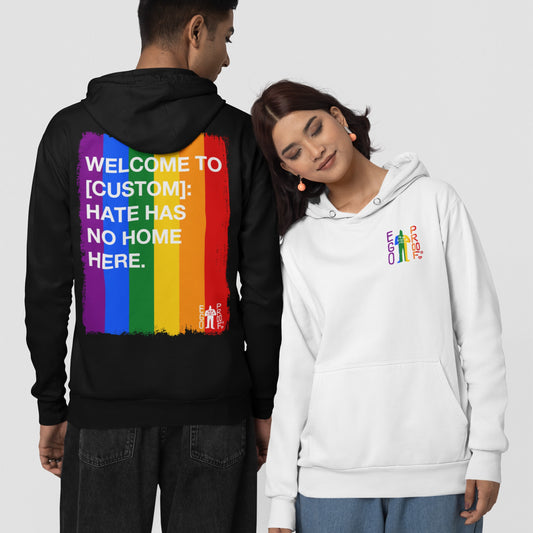 Custom Hate Has No Home Here Pride Hoodie featuring a rainbow-striped back design with an anti-hate message and a small rainbow graphic on the front, promoting LGBTQ+ inclusivity.