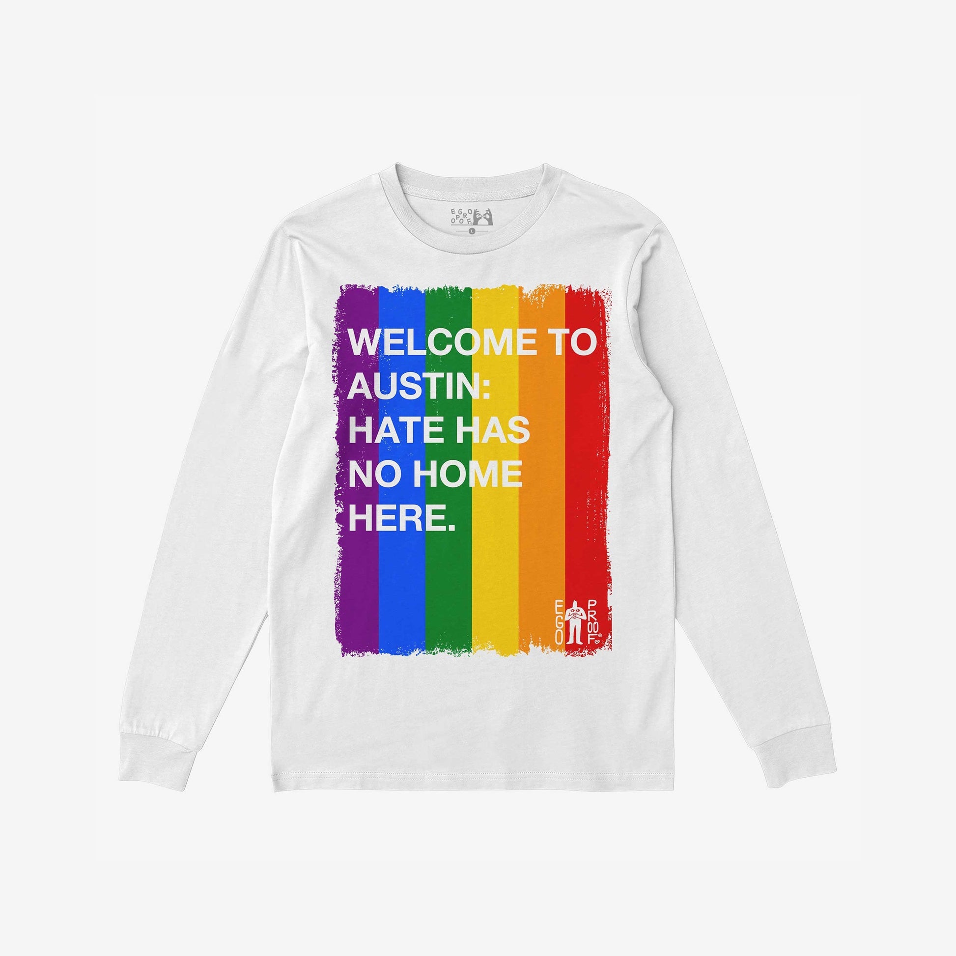 Custom Hate Has No Home Here Pride Long Sleeve T-shirt featuring a vertical rainbow brush stroke design with bold white text promoting inclusivity. Includes EGO PROOF logo. Perfect for events or everyday wear.