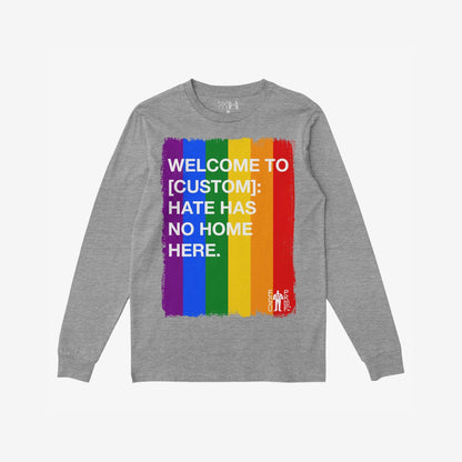 Custom Hate Has No Home Here Pride Long Sleeve T-shirt featuring a painted rainbow-stripe rectangle with WELCOME TO [CUSTOM]: HATE HAS NO HOME HERE in white letters, embodying inclusivity and empowerment from Egoproof.