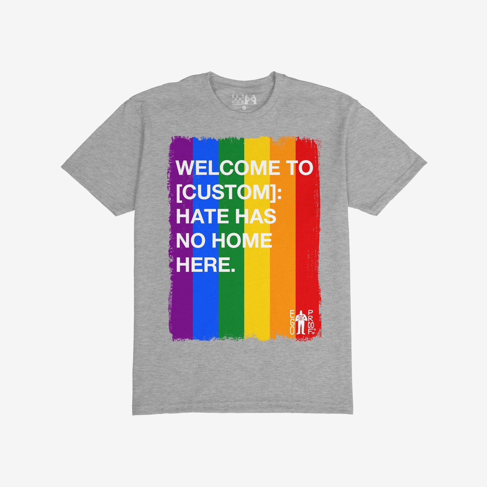 Custom Hate Has No Home Here Pride T-shirt features a brushed rainbow stripe with bold text promoting inclusion. Personalize with your community name to champion unity and acceptance.