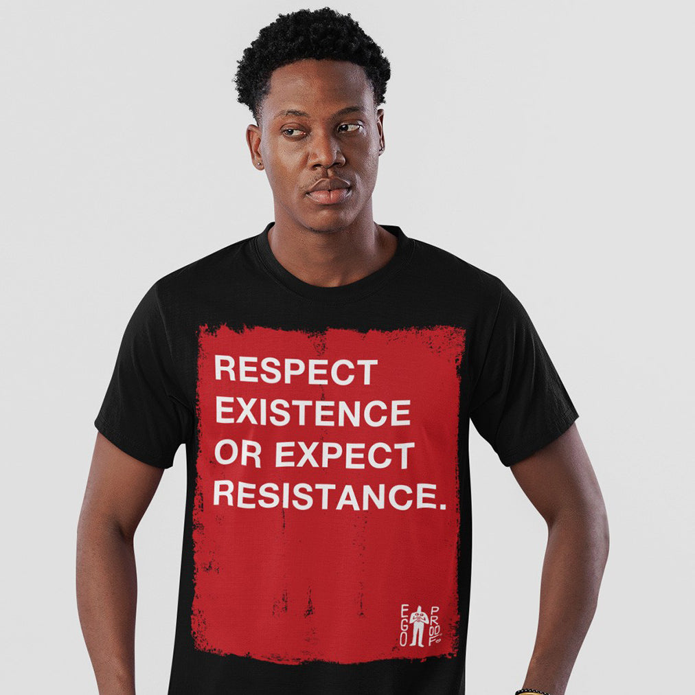 Person wearing a black t-shirt that says Respect Existence Or Expect Resistance.