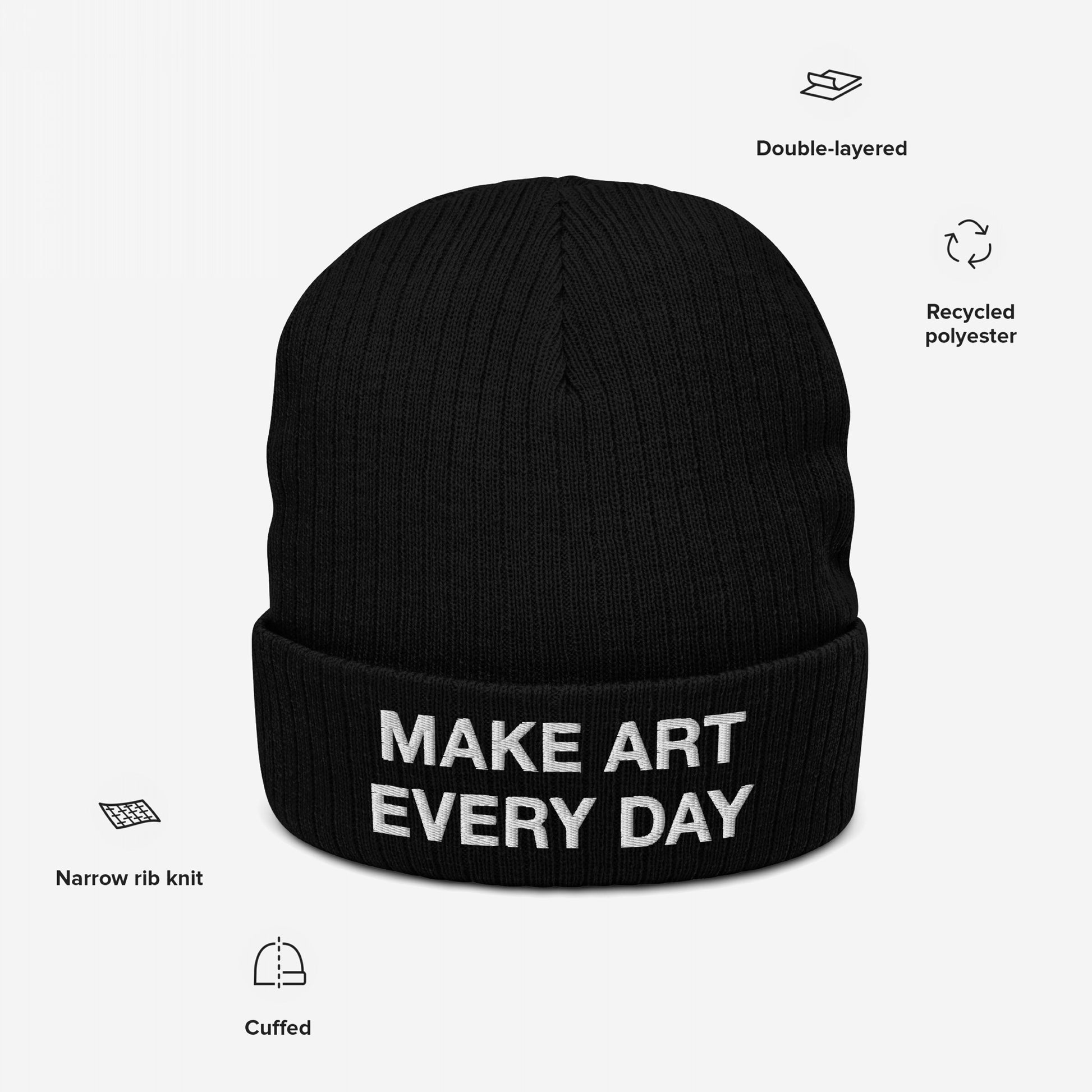 Make Art Every Day Hat: Black knit beanie with white MAKE ART EVERY DAY embroidered on the front. Features double-layered recycled polyester and narrow rib knit, promoting creativity and daily artistic expression.