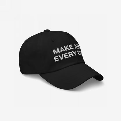 Black baseball-style cap with MAKE ART EVERY DAY embroidered on the front, featuring adjustable fit and timeless design. Emphasizes creativity with EGOPROOF embroidery, suitable for artists and creatives.