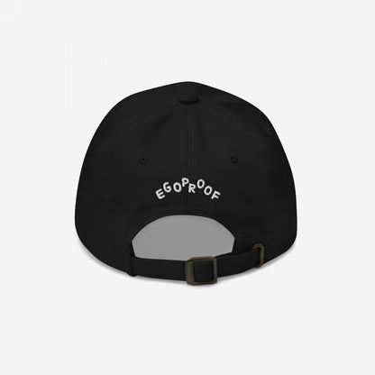 Back view of the Make Art Every Day Hat, a black six-panel baseball cap with EGOPROOF embroidered in white above the adjustable strap, featuring a metal buckle for size adjustment.