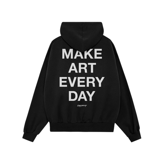 Black Make Art Every Day Hoodie, back view, featuring bold white lettering down the center. A small designer signature appear