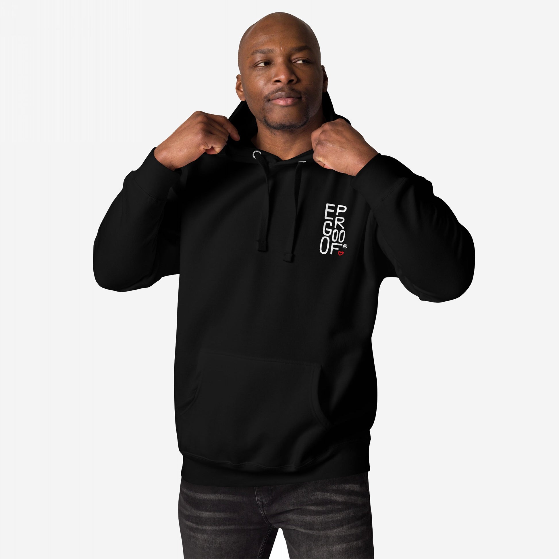 Make Art Every Day Hoodie EU features a male model in a black pullover, gripping drawstrings, with a white chest graphic and kangaroo pocket, embodying artistic expression and everyday comfort.