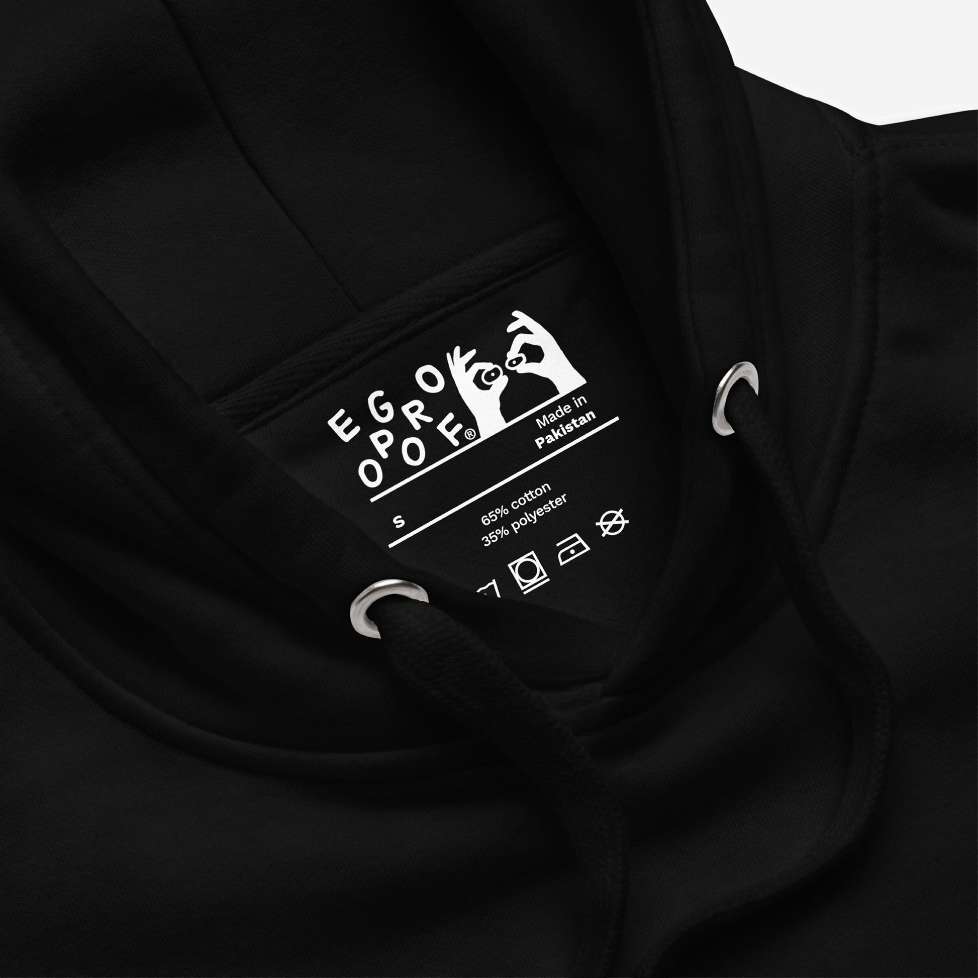 Inside neck view of the Make Art Every Day Hoodie EU, showcasing the EGROPOOF label, care instructions, and hoodie drawcords. Crafted for creators, blending comfort with a bold art-inspired statement.