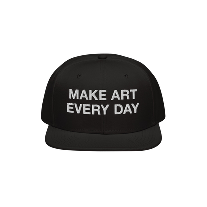 Black flat-brim snapback cap titled Make Art Every Day featuring bold white embroidered message, encouraging creativity and p