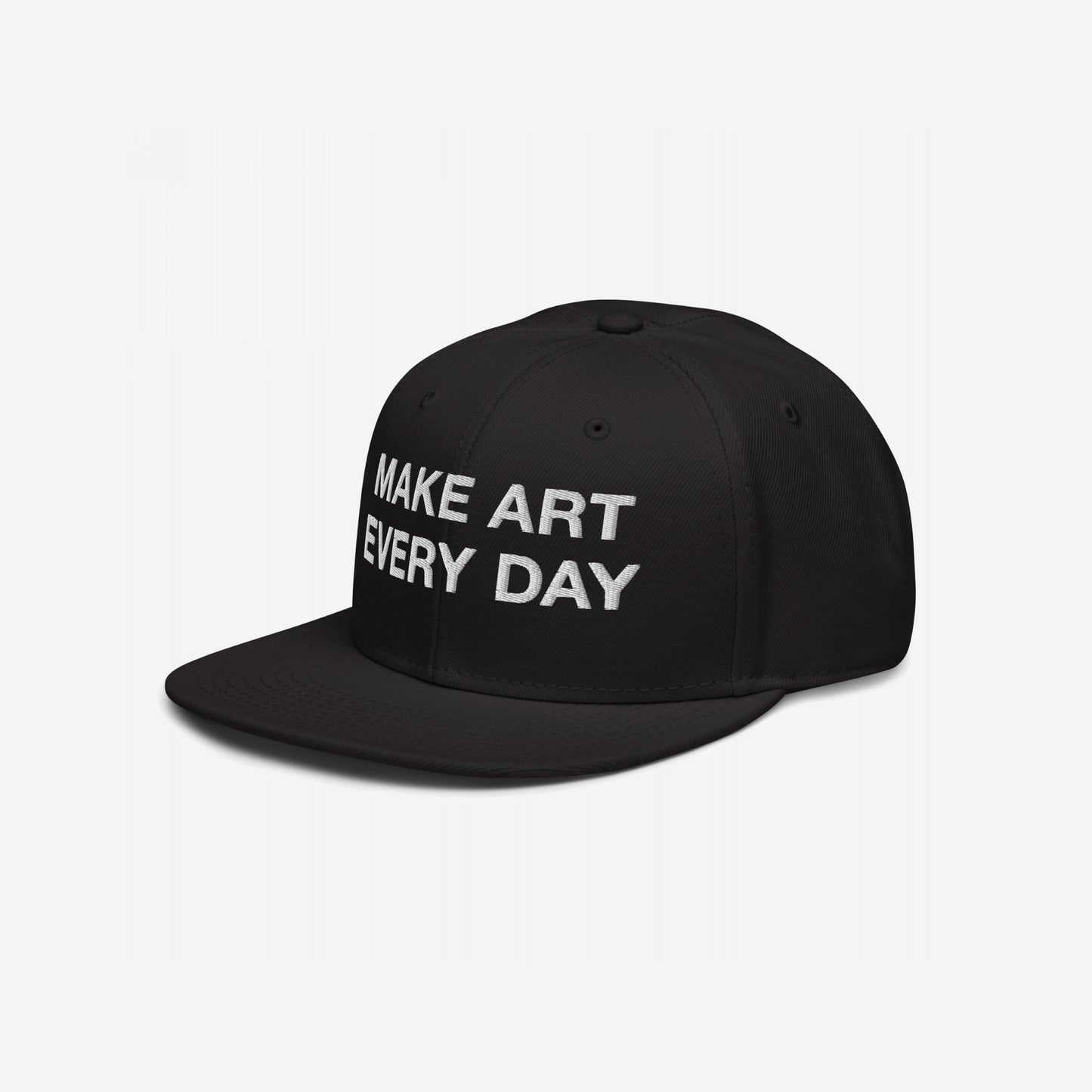 Make Art Every Day Hat: Black snapback cap with 'MAKE ART EVERY DAY' embroidered in white on the front, embodying creativity and persistence. Features EGOPROOF embroidery, adjustable fit, perfect for artistic expression.