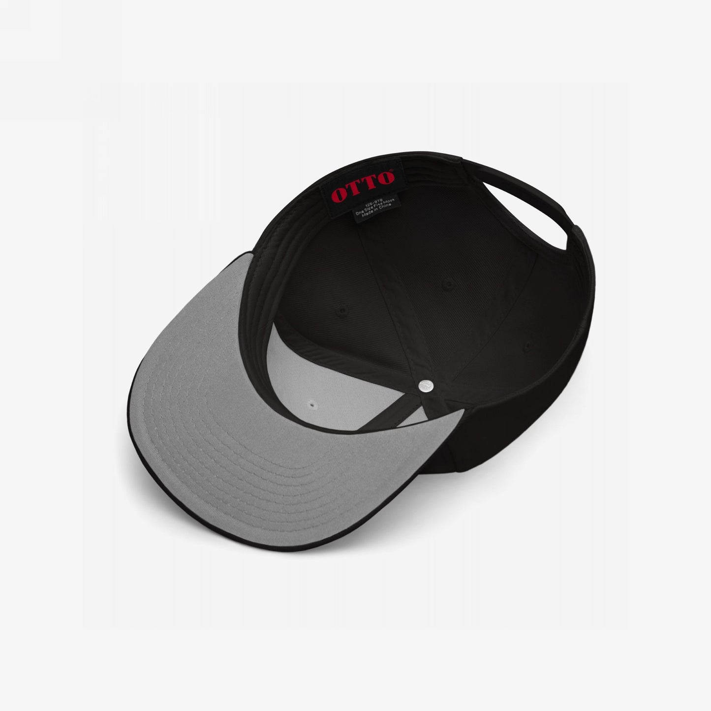 Inside view of the Make Art Every Day Hat, showcasing the black snapback design with a gray visor underside. Features red OTTO label and back EGOPROOF embroidery, promoting daily creativity.