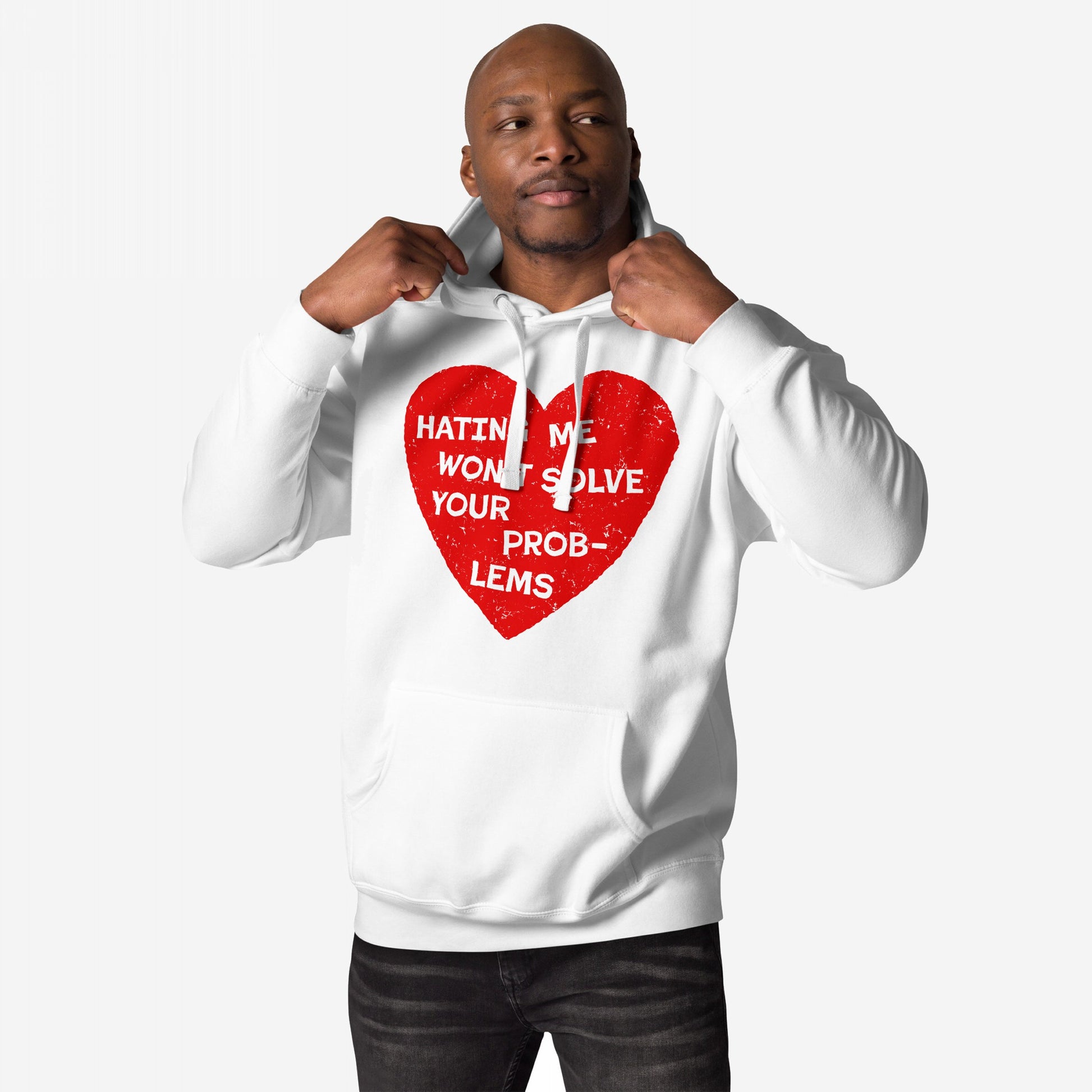 Person wearing the No Hate Hoodie EU with a distressed red heart and bold message, Hating Me Won’t Solve Your Problems, tugging drawstrings; embodies activism and comfort from Egoproof.