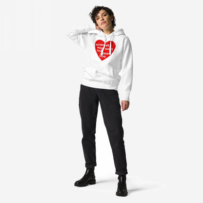 Woman models the No Hate Hoodie EU, featuring a distressed red heart with “Hating Me Won’t Solve Your Problems” text, paired with black jeans and chunky boots, embodying Egoproof’s bold, statement-driven style.