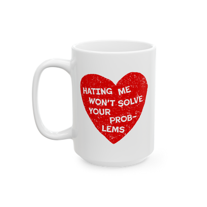 No Hate Mug featuring “Hating Me Won’t Solve Your Problems” quote over a red heart on a white ceramic coffee mug.