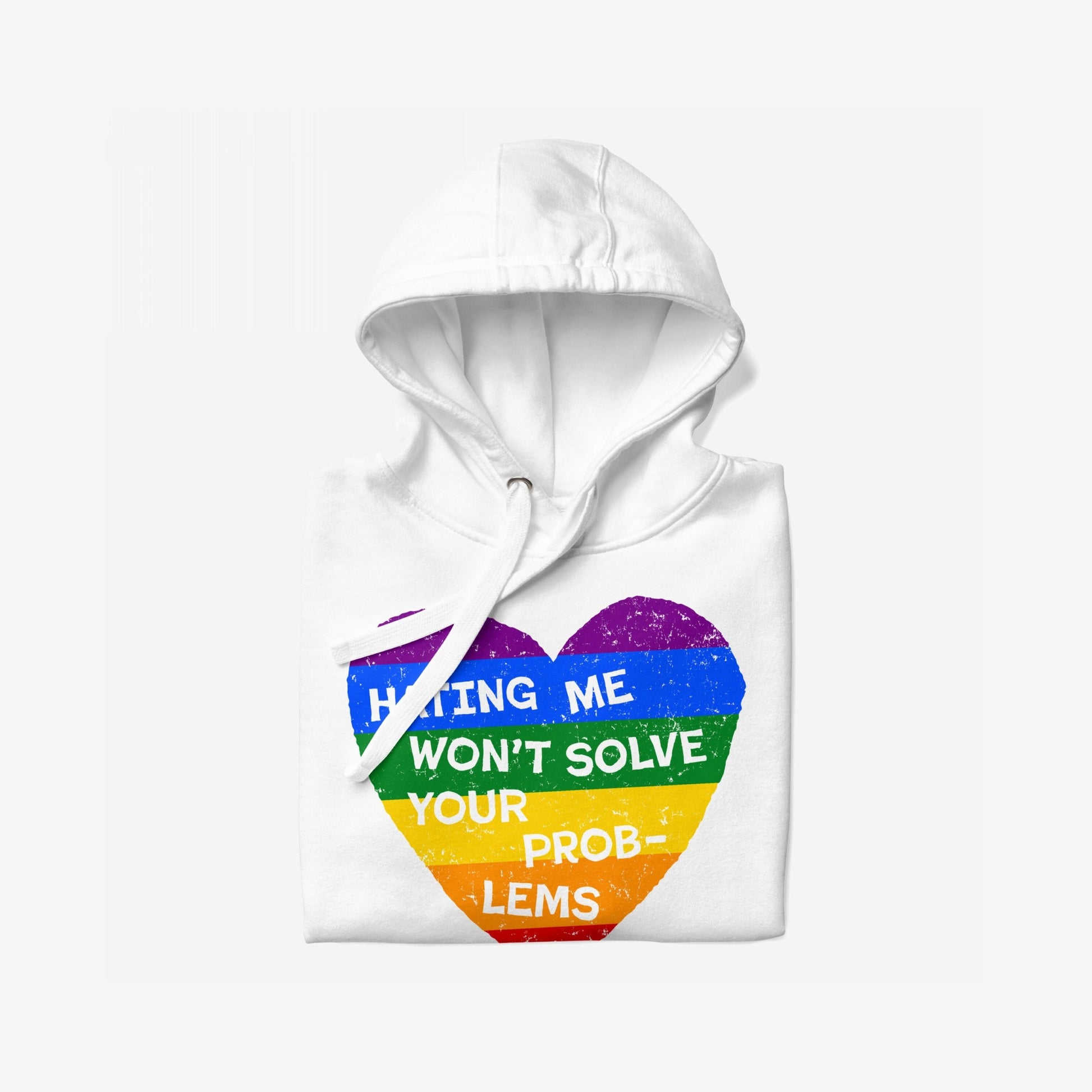 No LGBTQ Hate Hoodie EU: Folded white hoodie with rainbow-striped heart graphic and bold slogan “Hating Me Won’t Solve Your Problems,” reflecting defiance and pride. Designed for comfort and impactful expression.