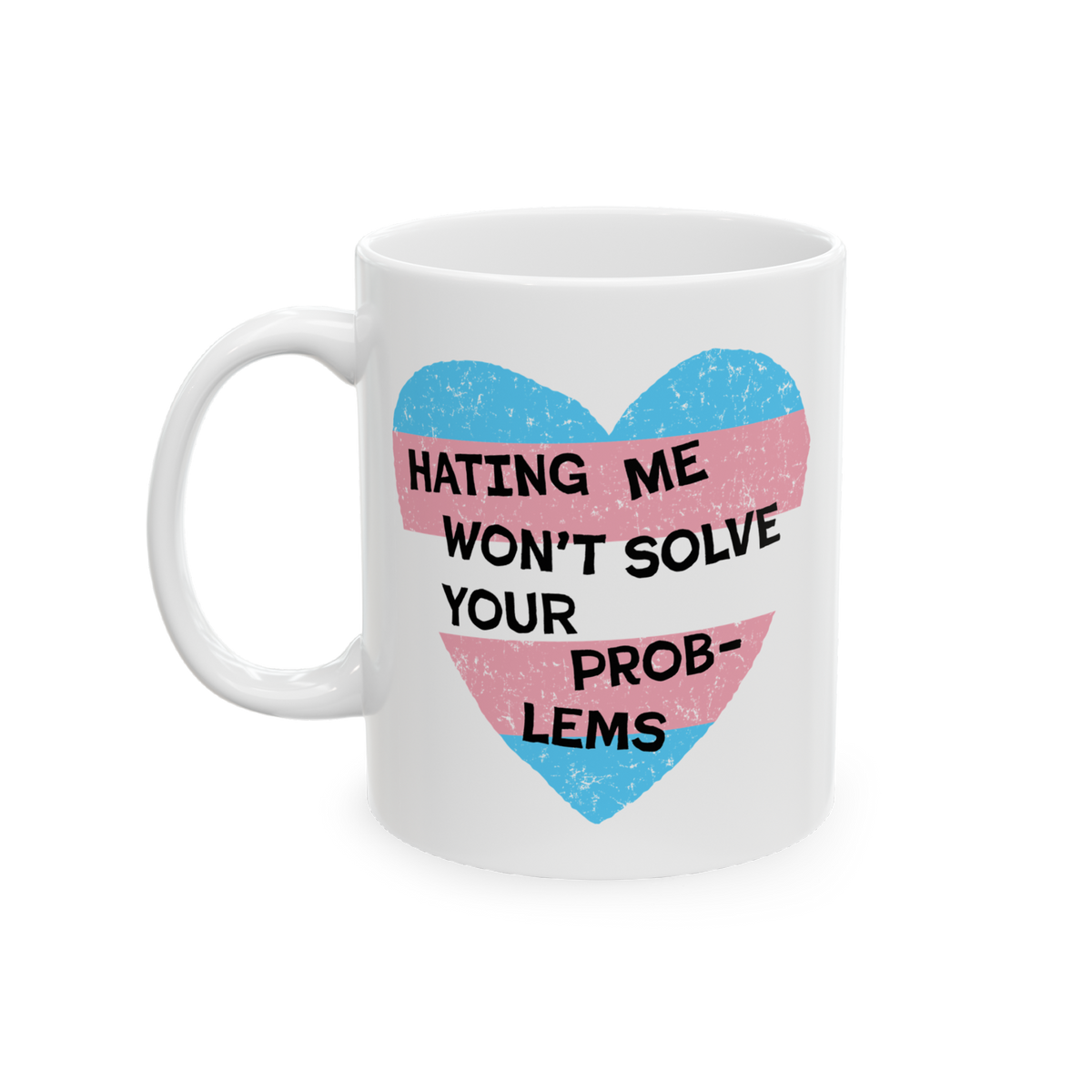 Close-up of the No Trans Hate Mug featuring a pastel-striped heart and the quote, “Hating Me Won’t Solve Your Problems,��