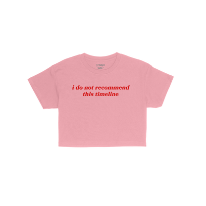 Timeline Women's Baby Tee pink cropped Y2K inspired tee with red "i do not recommend this timeline" text, perfect for millenn
