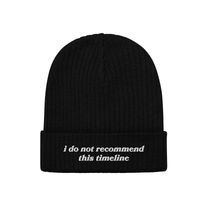 A black rib-knit Timeline Hat with a folded cuff, featuring white embroidered text: “i do not recommend this timeline.” P