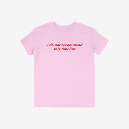 Timeline Kids T-shirt in light pink with red text "i do not recommend this timeline" for teens and tweens.